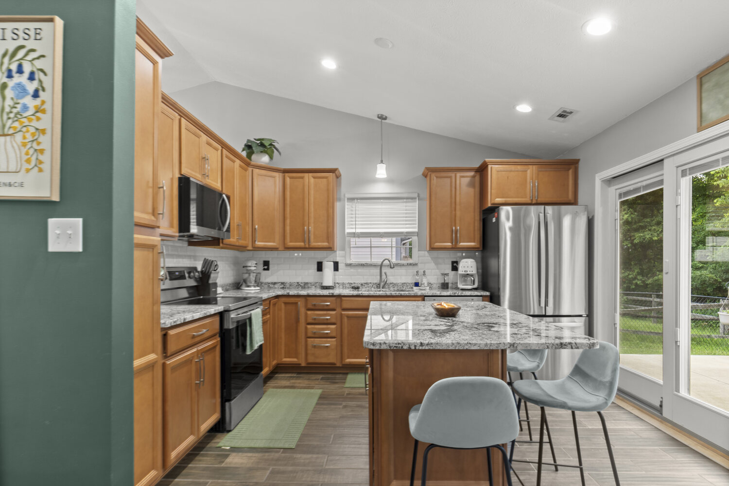 Remodeled kitchen with island and tall ceilings