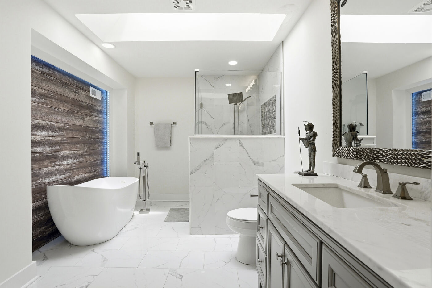 Renovated primary bath with freestanding tub