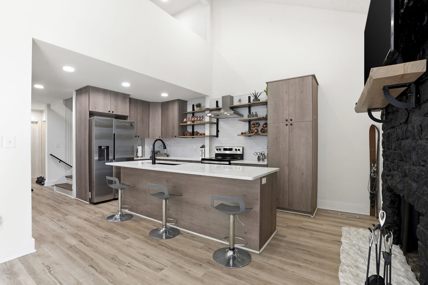 Renovated kitchen with island and open shelving